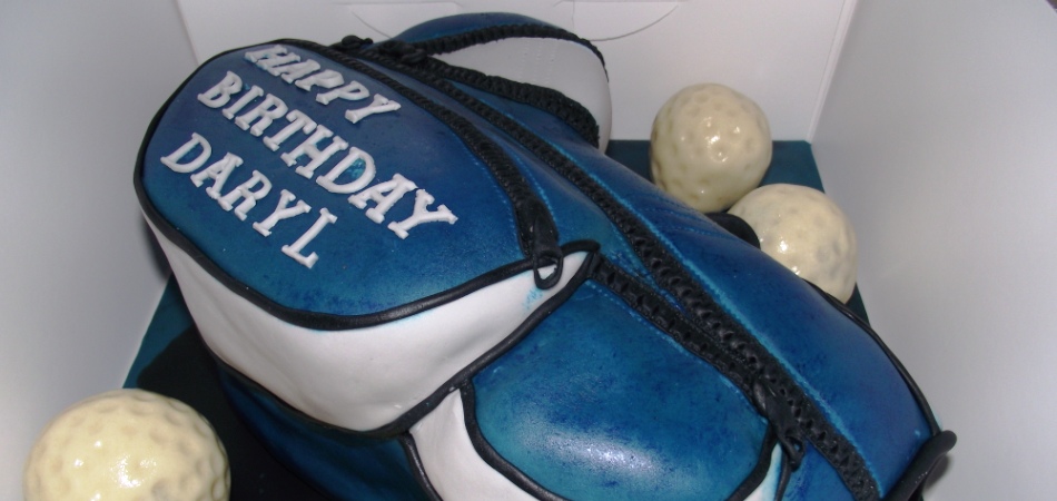 "Carved novelty birthday golf bag cake with rum golf balls :)"